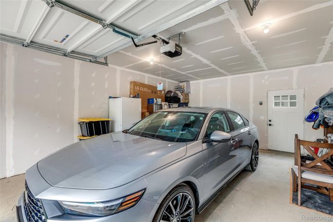 Interior view of the garage and storage area | Image 29