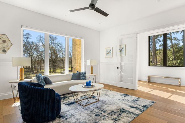 Living area featuring hardwood / wood-style flooring, a ceiling fan, and plenty of natural light | Image 21