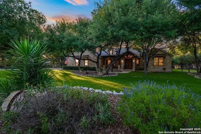 Fully landscaped front yard at twilight | Image 7