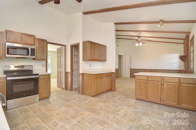 Kitchen looking into Den | Image 15