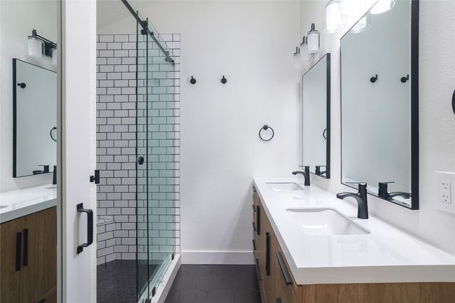 Updated primary bathroom exudes fresh, modern living. | Image 20