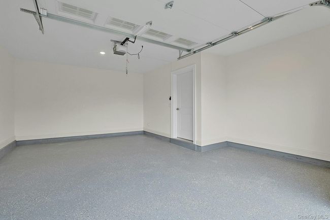 Garage with epoxy flooring | Image 27