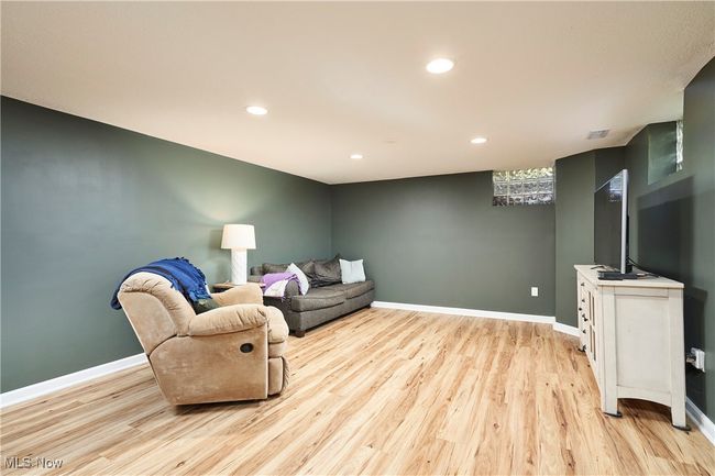Living room featuring light wood-style floors, baseboards, and recessed lighting | Image 23