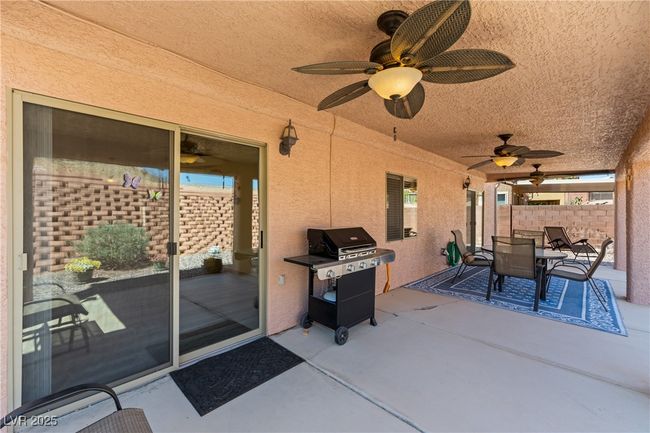 View of patio / terrace featuring ceiling fan, outdoor dining area, and a grill | Image 39