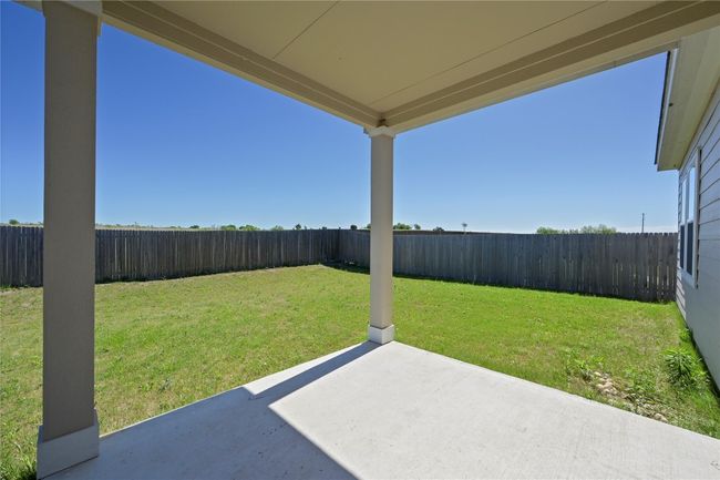 View of yard with a fenced backyard and a patio area | Image 34