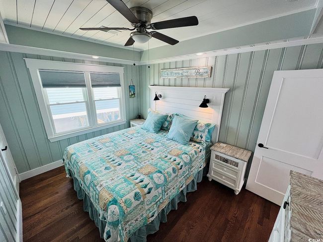 Bedroom featuring dark hardwood / wood-style flooring and ceiling fan | Image 20