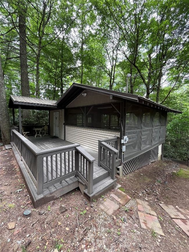 Community building with laundry facility and screened living porch. | Image 14