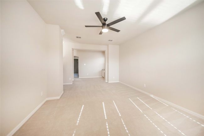 Unfurnished room featuring a ceiling fan and light carpet | Image 36