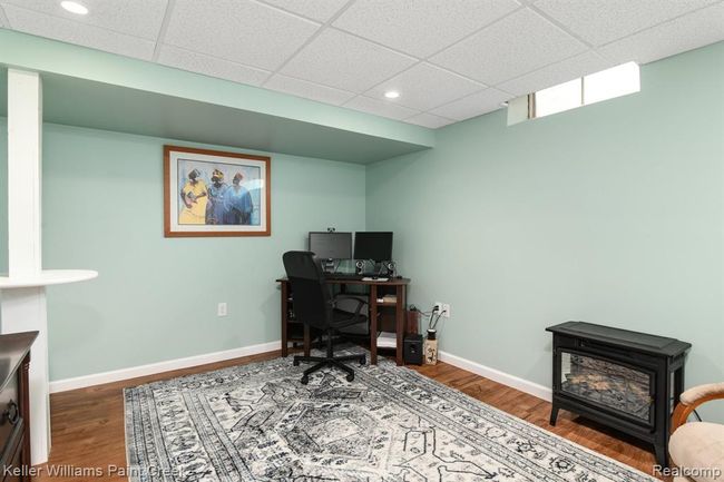Additional lower level room flexes as a second home office. | Image 15