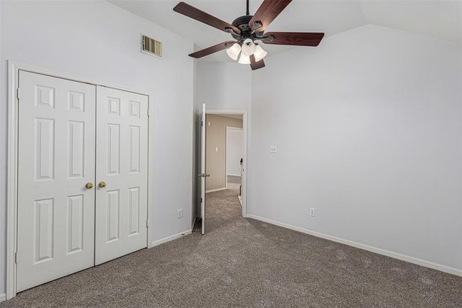 Secondary bedroom three is tucked away at the end of the walkway upstairs | Image 33