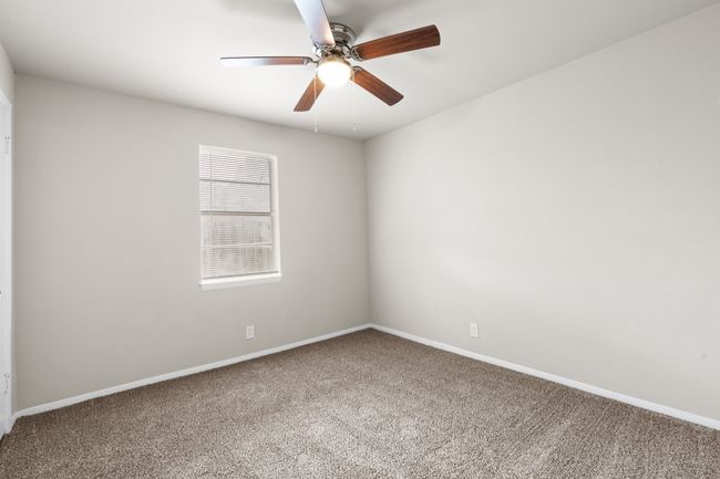 Spare room with carpet floors and ceiling fan | Image 13