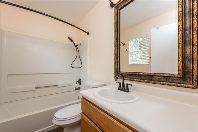 Full bath featuring shower / tub combination and vanity | Image 7