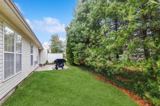 View of yard featuring a patio and fence | Image 4