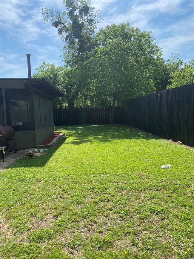 View of yard with a fenced backyard | Image 20