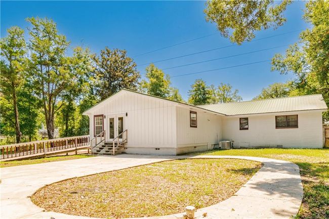 Back of property featuring a yard and a patio | Image 4