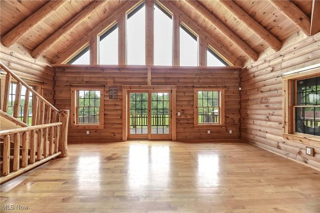 View of the great room looking to the wall of windows and patio slider. | Image 9