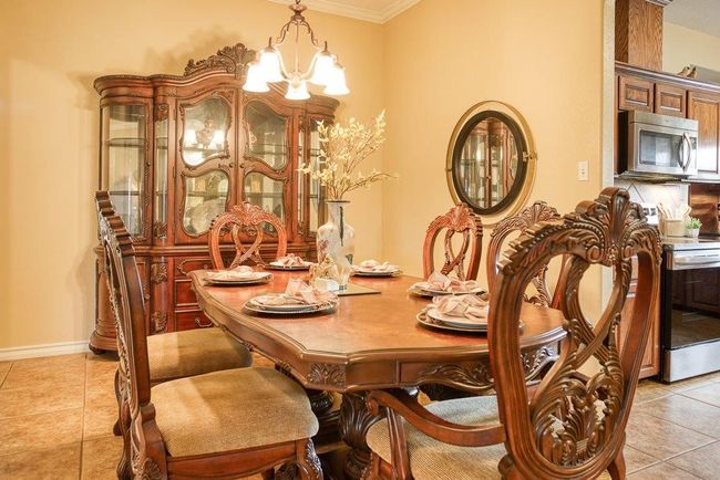 Gracious dining room with crown molding | Image 10