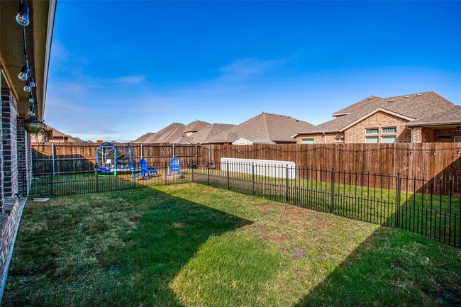 View of yard with a trampoline | Image 21