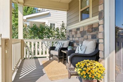 Sunny front porch is perfect for relaxing and chatting with neighbors | Image 2