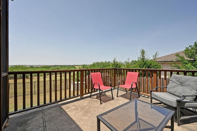 Step out onto the open air patio and take in picturesque greenbelt/reservoir views. | Image 22