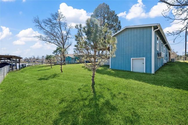 Under home storage area added. The perfect spot for the lawn equipment and water toys. | Image 24