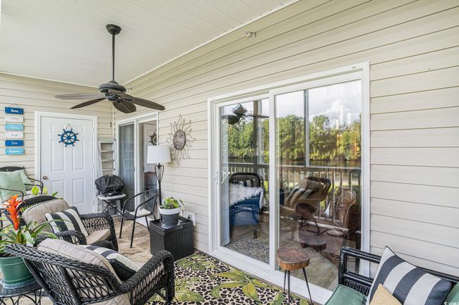 View of patio featuring ceiling fan and area for grilling | Image 20