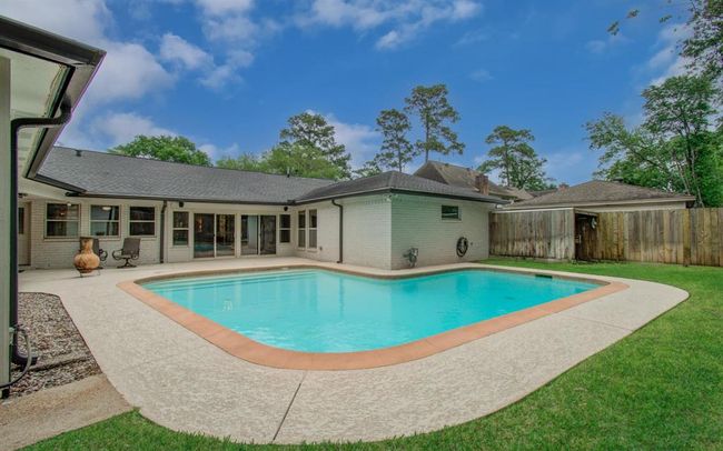 Pool equipment is fenced in on far side of yard. | Image 39