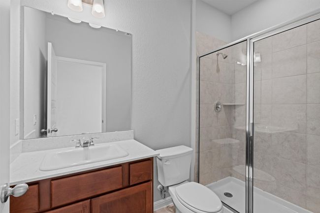 Full bathroom featuring vanity and a shower stall | Image 16