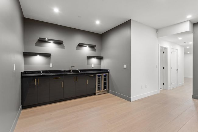 Bar featuring wet bar, recessed lighting, light wood-style floors, and baseboards | Image 14