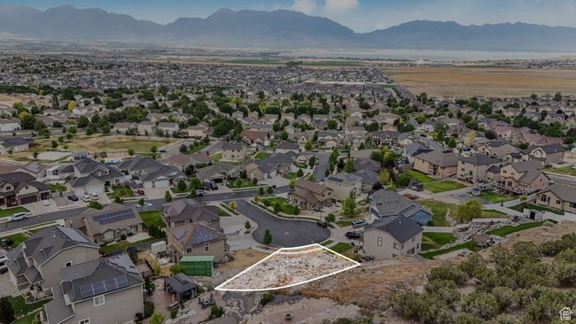 Aerial view of property and surrounding area with a mountain backdrop, property boundaries highlighted, and nearby suburban area | Image 4