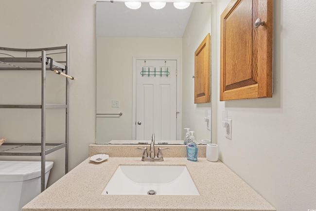 Bathroom featuring vanity and toilet | Image 32