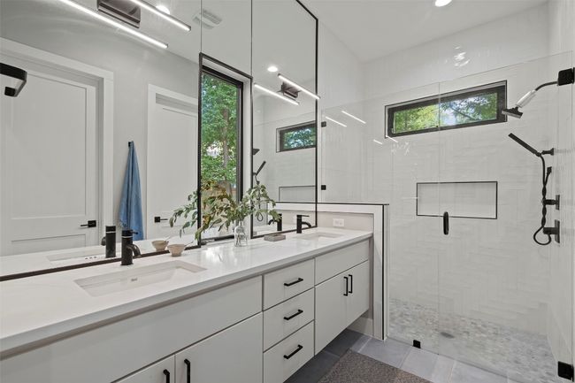Full bathroom with a shower stall, double vanity, and tile patterned flooring | Image 25