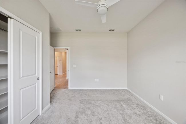 Bedroom 2 with built in closet , ceiling fan, blinds | Image 21