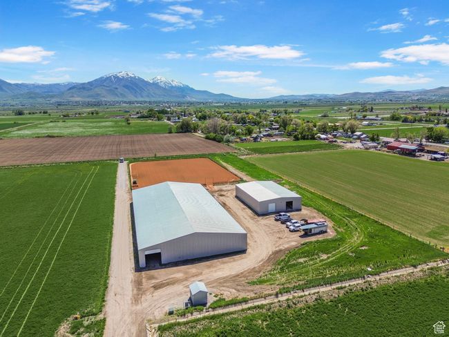 Aerial view of sparsely populated area with a mountain backdrop | Image 8