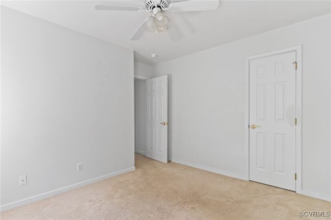 Unfurnished bedroom with carpet flooring and ceiling fan | Image 23