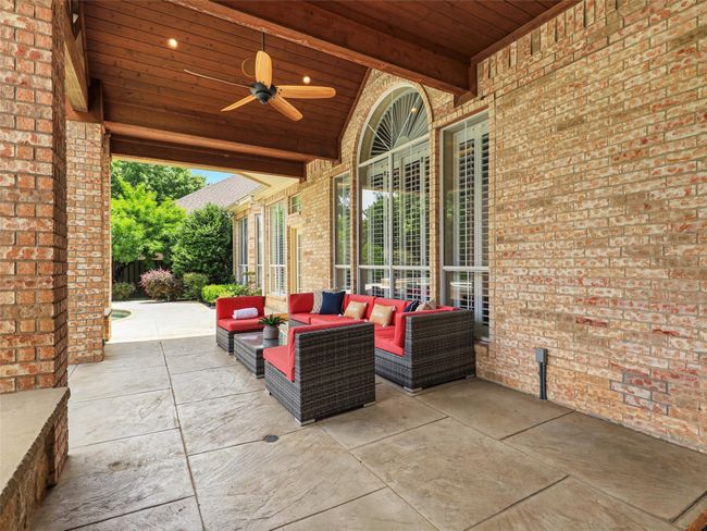 View of patio featuring an outdoor living space and ceiling fan | Image 37