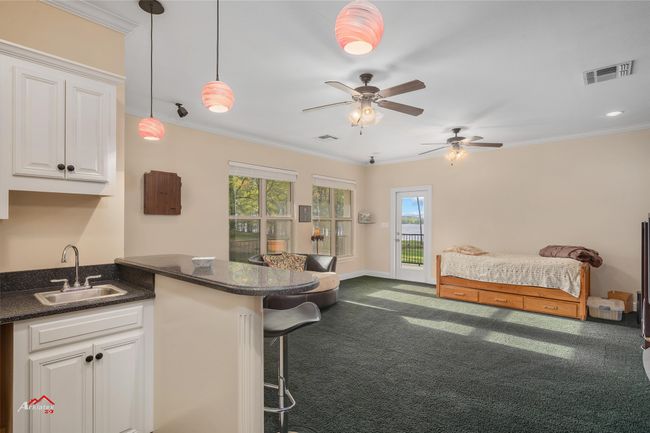Game/media room with lake views. | Image 34
