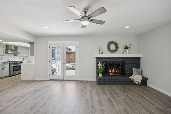 Check out this AMAZING Family Room - complete with woodburning fireplace with gas starter - French Doors to the Awesome patio, pool and backyard - open to that awesome kitchen and breakfast area as well! | Image 19