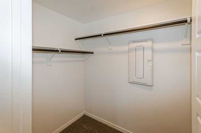 Walk in closet with carpet flooring and electric panel | Image 15