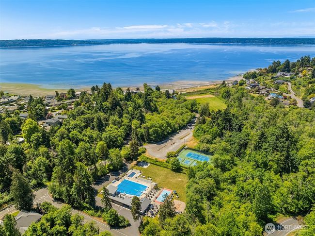 The property comes with Lot A beach rights to the Cove with trails, pickleball courts, 700' of shoreline and picnic tables as well as a boat launch. | Image 38