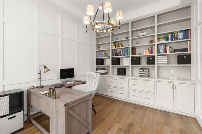Private study with accent paneled walls w/ custom cabinetry | Image 9
