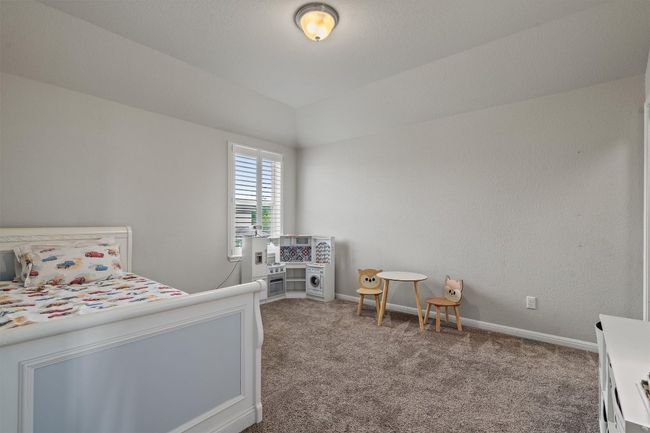 Bedroom with carpet and baseboards | Image 28
