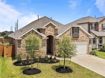 This cute one story has a three sided brick elevation, covered patio, and no back neighbors! | Image 3