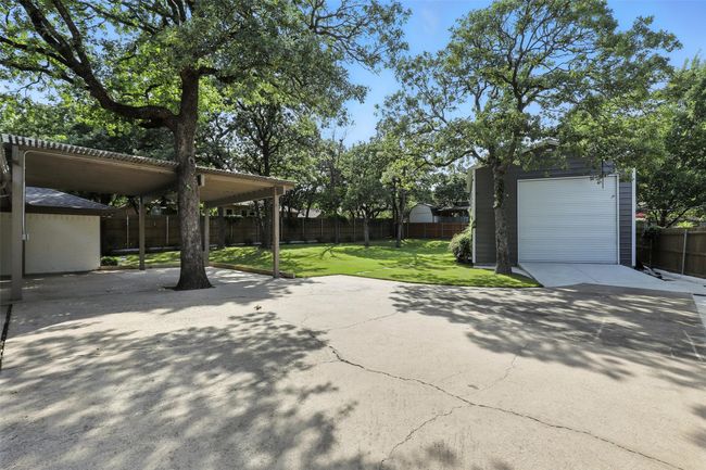 View of patio featuring an outbuilding and a detached garage | Image 37