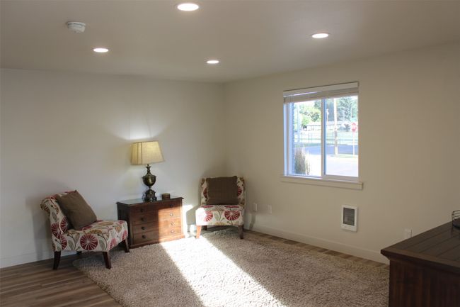 Living area with recessed lighting and wood finished floors | Image 6