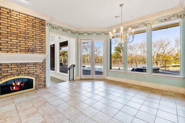 Sipping your morning coffee snuggled by this awesome fireplace while overlooking this oasis. Ahhhhhhhhhh | Image 31
