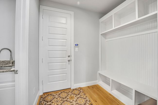Mudroom with hardwood / wood-style flooring and sink | Image 12