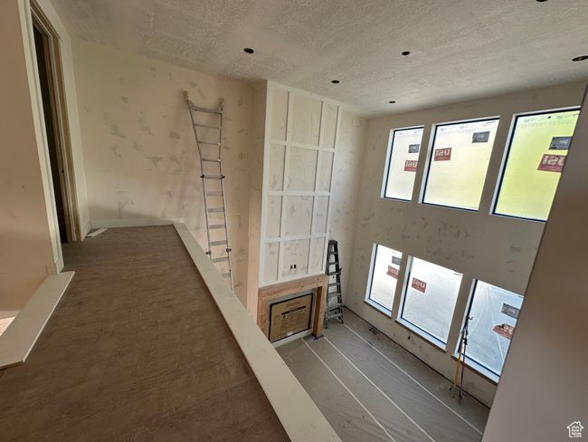 Hall with a textured ceiling | Image 13