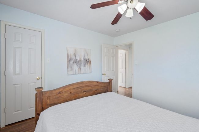 Bedroom featuring a ceiling fan and wood finished floors | Image 26
