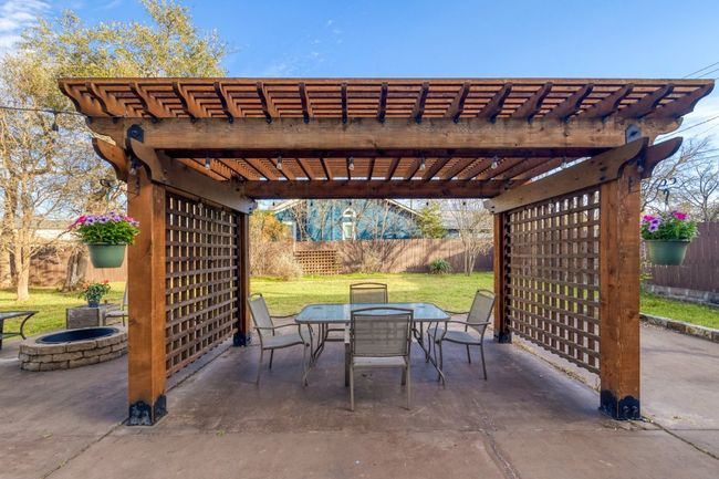The pergola-covered patio is ideal for those warm afternoons when you want to enjoy a meal outside, sip a drink with friends, or just kick back and let the day pass by | Image 27